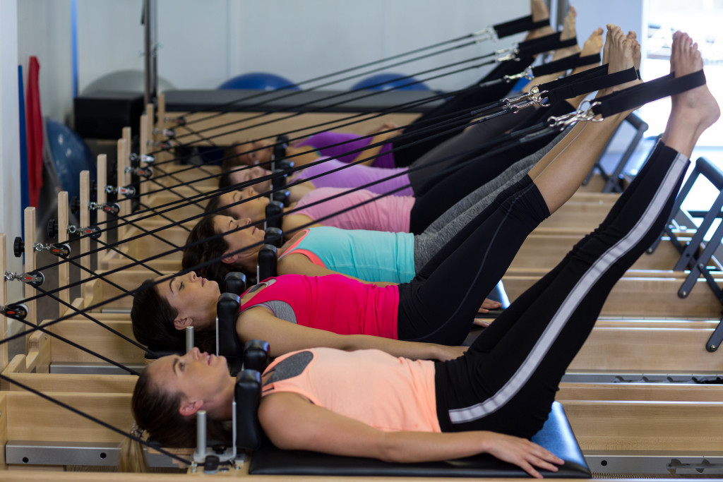 A bunch of ladies doing yoga