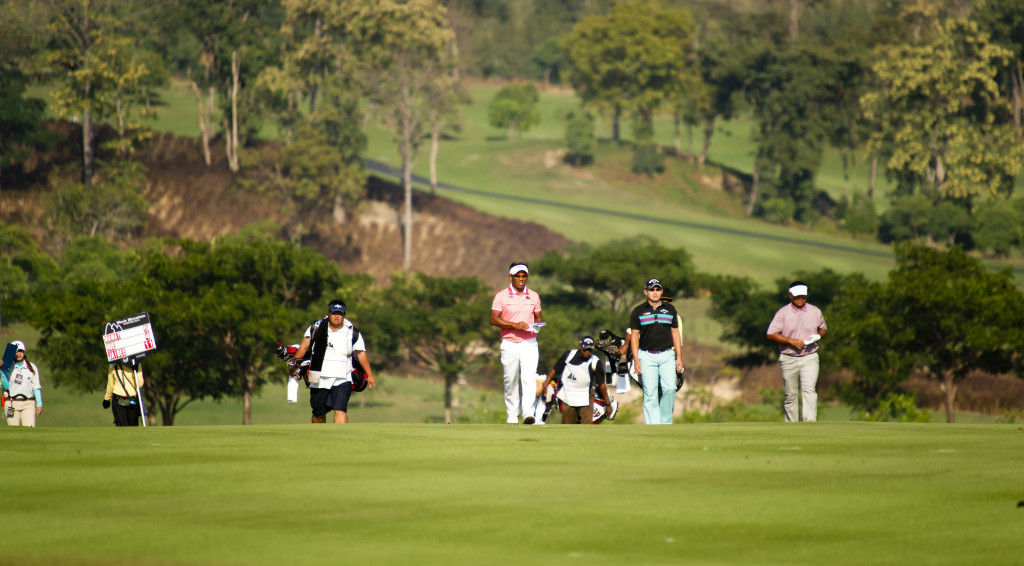 Golfers preparing for a golf tournament