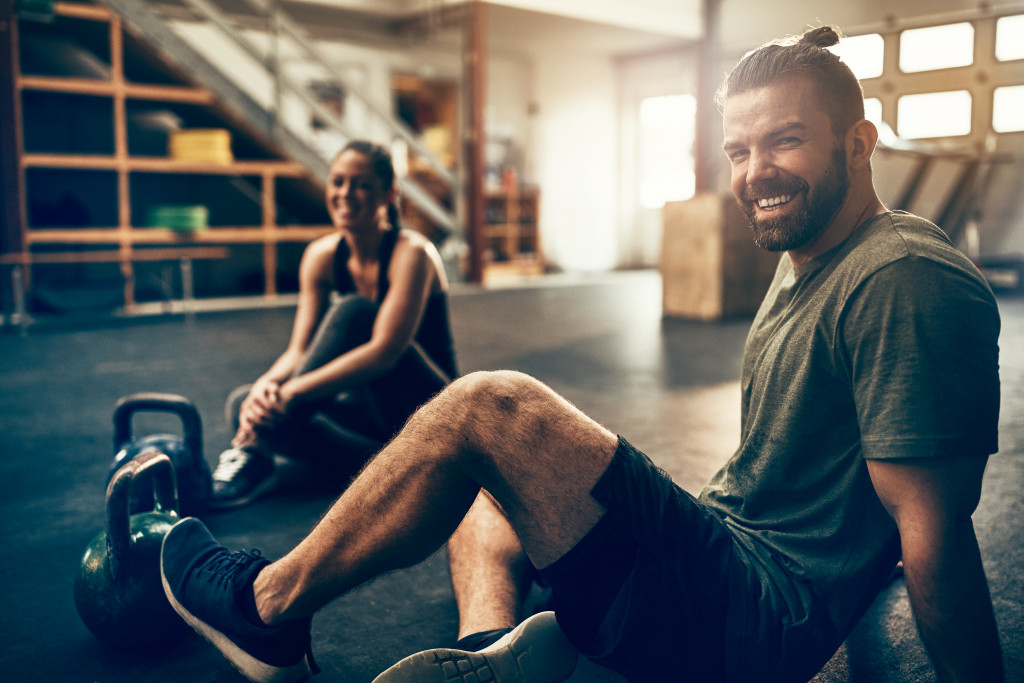 Gym owner with a client