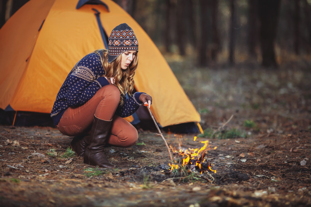 A woman camping in a forest