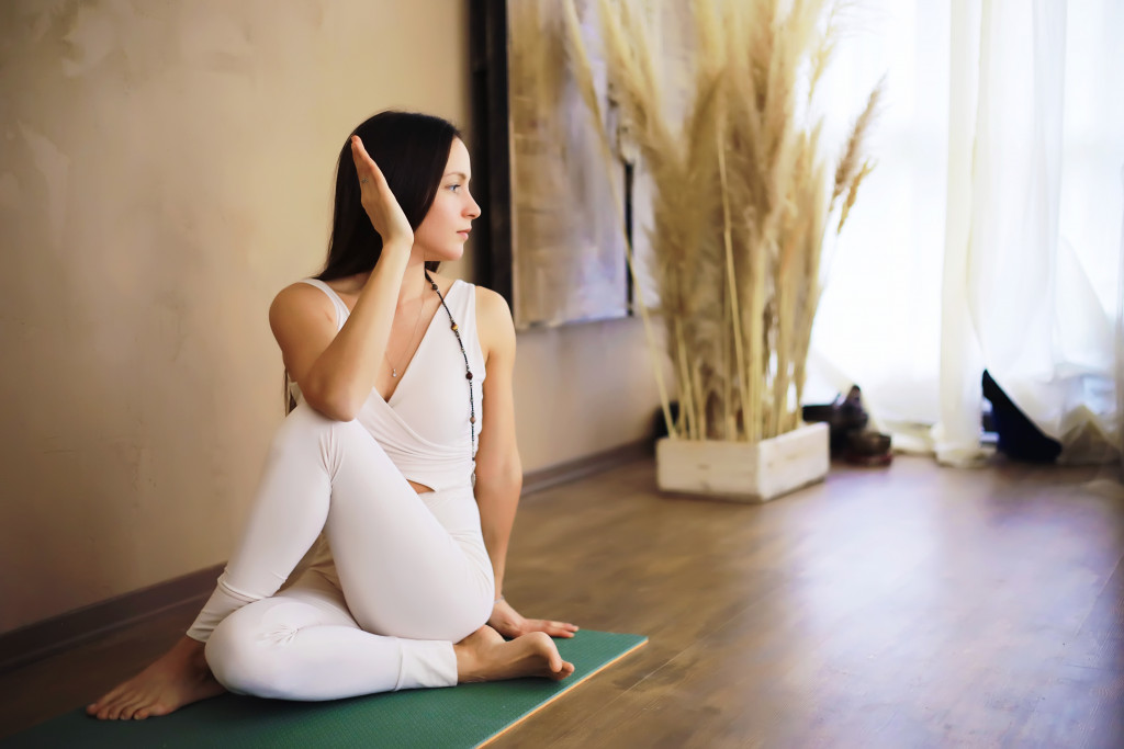 young woman doing yoga at home